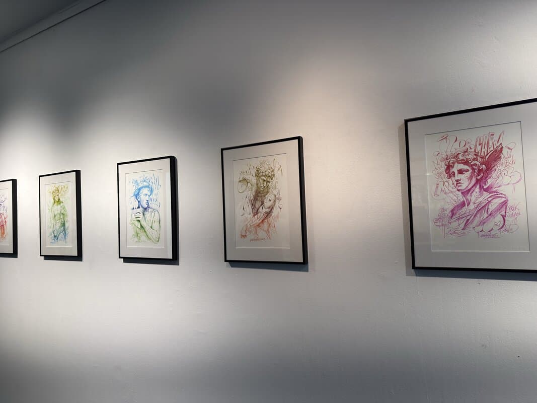 Framed portrait series showing colorful sketched portraits in different hues