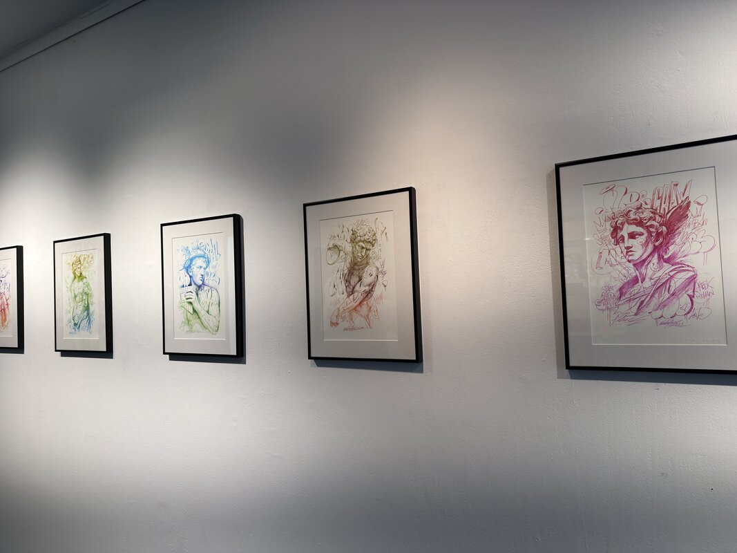 Framed portrait series showing colorful sketched portraits in different hues